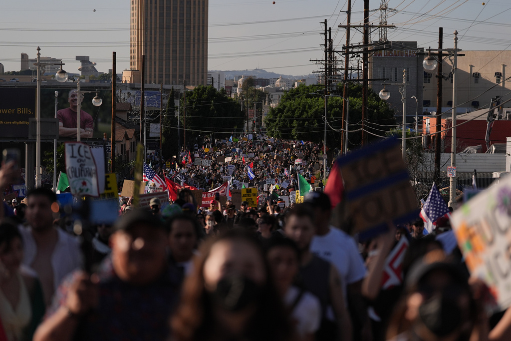 People fill the streets during a protest in Los Angeles on Friday, Jan. 30, 2026. (AP Photo/Jae C. Hong)
