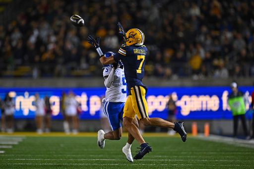 California Golden Bears wide receiver Trond Grizzell (7) reaches for a pass while being guarded by Duke Blue Devils cornerback Kimari Robinson (5) in the first half of their game at Memorial Stadium in Berkeley, Calif., on Saturday, Oct. 4, 2025. (Jose Carlos Fajardo/Bay Area News Group via AP) California Golden Bears wide receiver Trond Grizzell (7) reaches for a pass while being guarded by Duke Blue Devils cornerback Kimari Robinson (5) in the first half of their game at Memorial Stadium in Berkeley, Calif., on Saturday, Oct. 4, 2025. (Jose Carlos Fajardo/Bay Area News Group via AP)