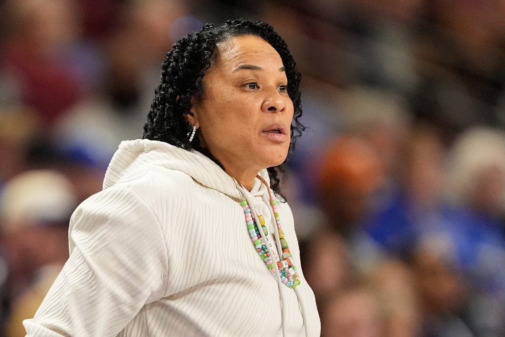 South Carolina head coach Dawn Staley watchers during first half of an NCAA college basketball game against Kentuck in the quarterfinals of the Southeastern Conference tournament, Friday, March 6, 2026, in Greenville, S.C. (AP Photo/Chris Carlson)
