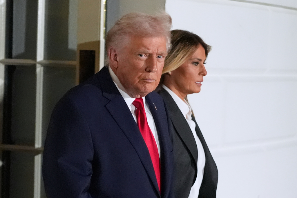 President Donald Trump and first lady Melania Trump, walk out of the White House, Tuesday, Feb. 24, 2026, to travel to the U.S. Capitol where he will deliver the State of the Union address to a joint session of Congress in the House chamber, in Washington. (AP Photo/Manuel Balce Ceneta)