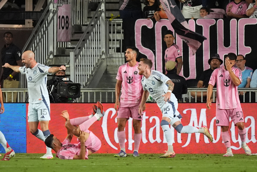 Inter Miami players react as Chicago Fire defender Andrew Gutman (15) and defender Joel Waterman (16) celebrate their side's first goal during the first half of an MLS soccer match, Tuesday, Sept. 30, 2025, in Fort Lauderdale, Fla. (AP Photo/Rebecca Blackwell)