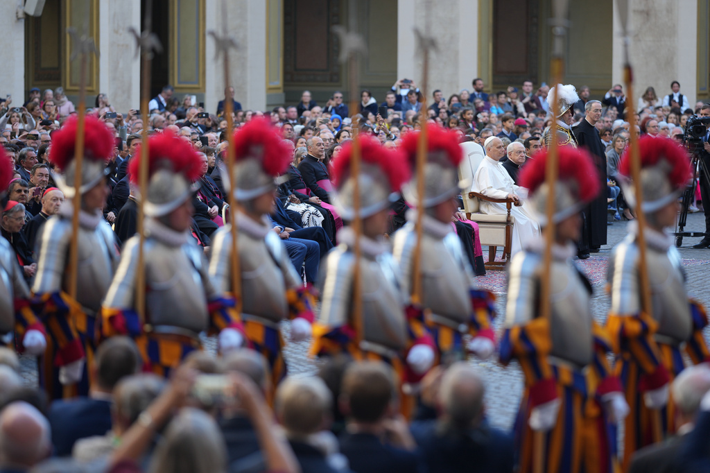 Pope Leo XIV attends the swearing in ceremony of 27 Pontifical Swiss Guards cadets in the St. Damasus courtyard at the Vatican, Saturday, Oct. 4, 2025. (AP Photo/Andrew Medichini)