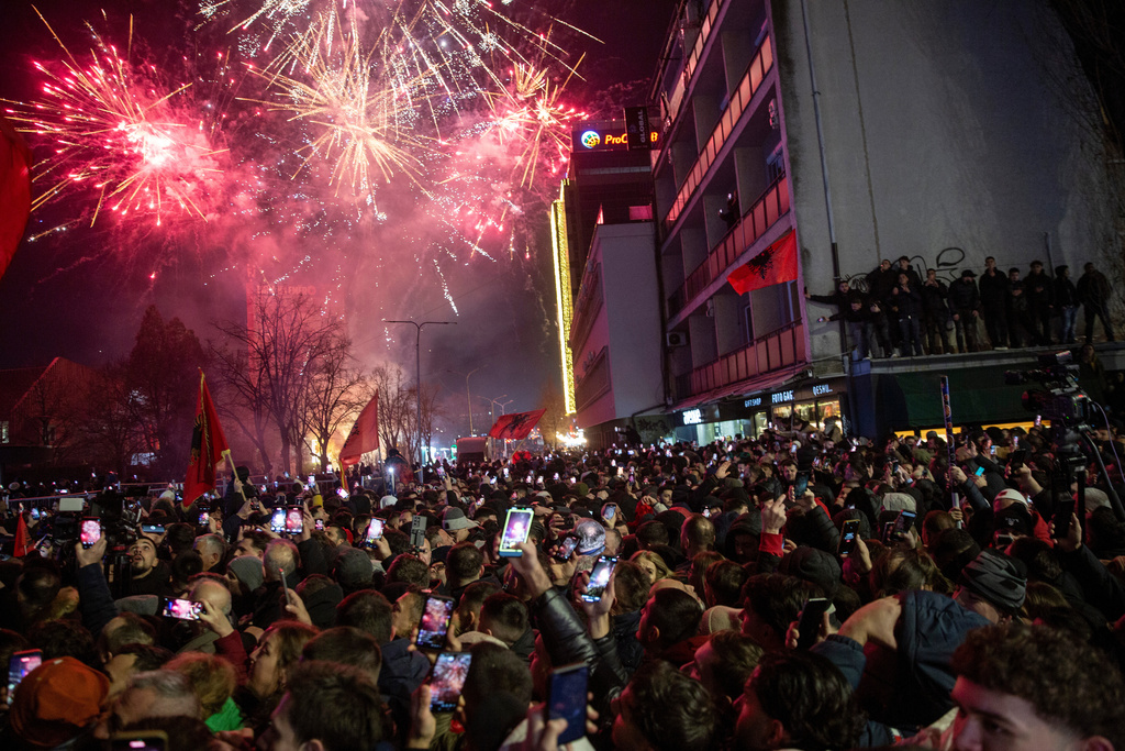 Supporters of Vetevendosje political party celebrate election results in Kosovo's capital Pristina, Sunday Dec. 28, 2025. (AP Photo/Visar Kryeziu)