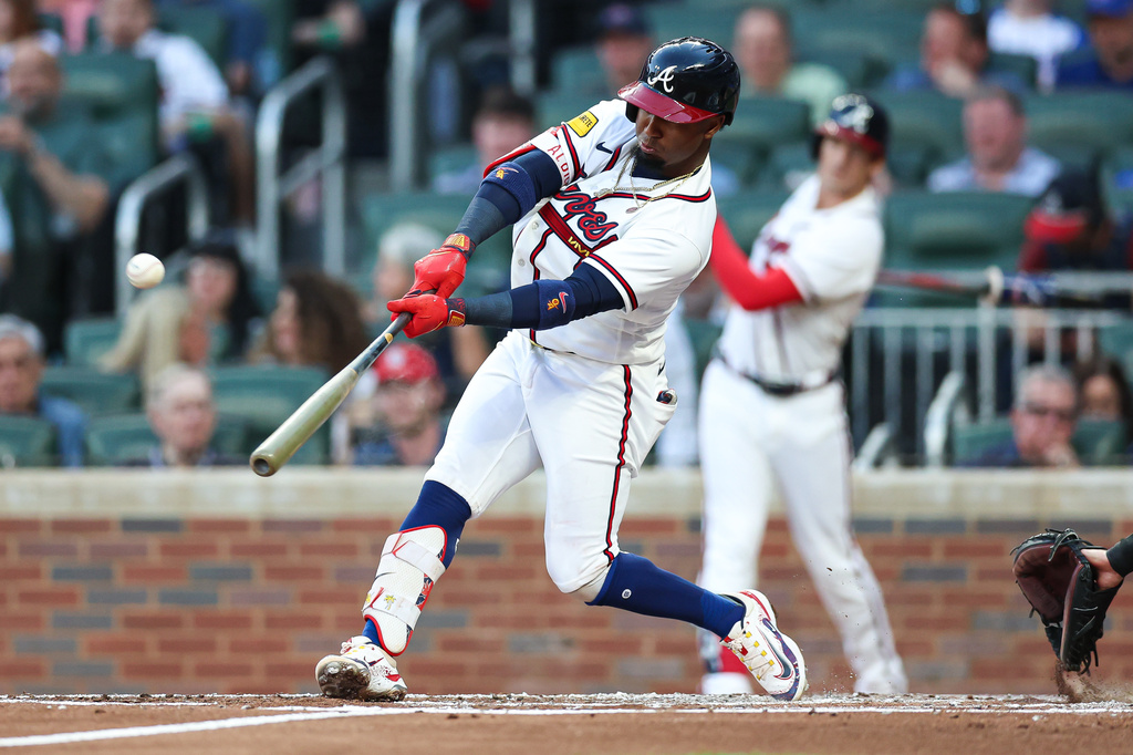 Atlanta Braves' Ozzie Albies hits a solo home run in the second inning of a baseball game against the Miami Marlins, Wednesday, April 15, 2026, in Atlanta. (AP Photo/Colin Hubbard)