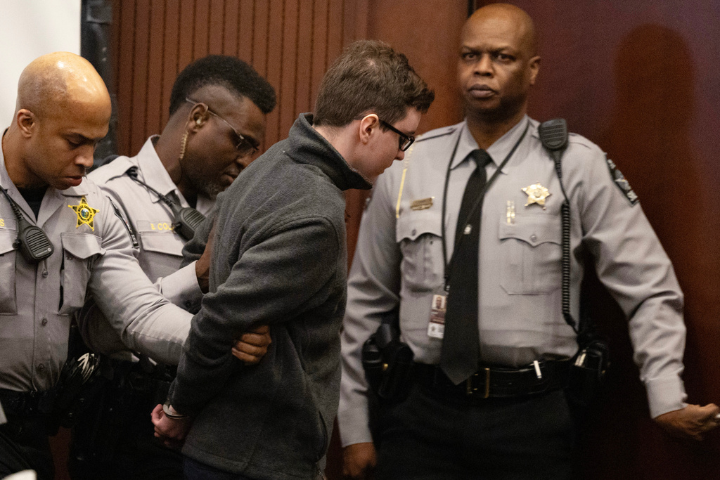 Deputies lead a handcuffed Austin Thompson from the courtroom in Raleigh, N.C., on Friday, Feb. 13, 2026, after he was sentenced to five life sentences without the possibility of parole. (Scott Sharpe/The News & Observer via AP, Pool)