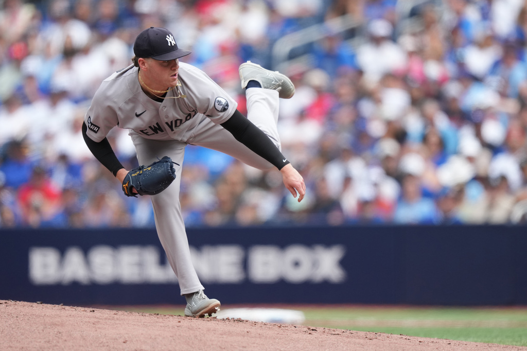 New York Yankees starting pitcher Ryan Weathers works against the Toronto Blue Jays during the first inning of a baseball game in Toronto, Sunday, Aug. 16, 2026. (Nathan Denette/The Canadian Press via AP)