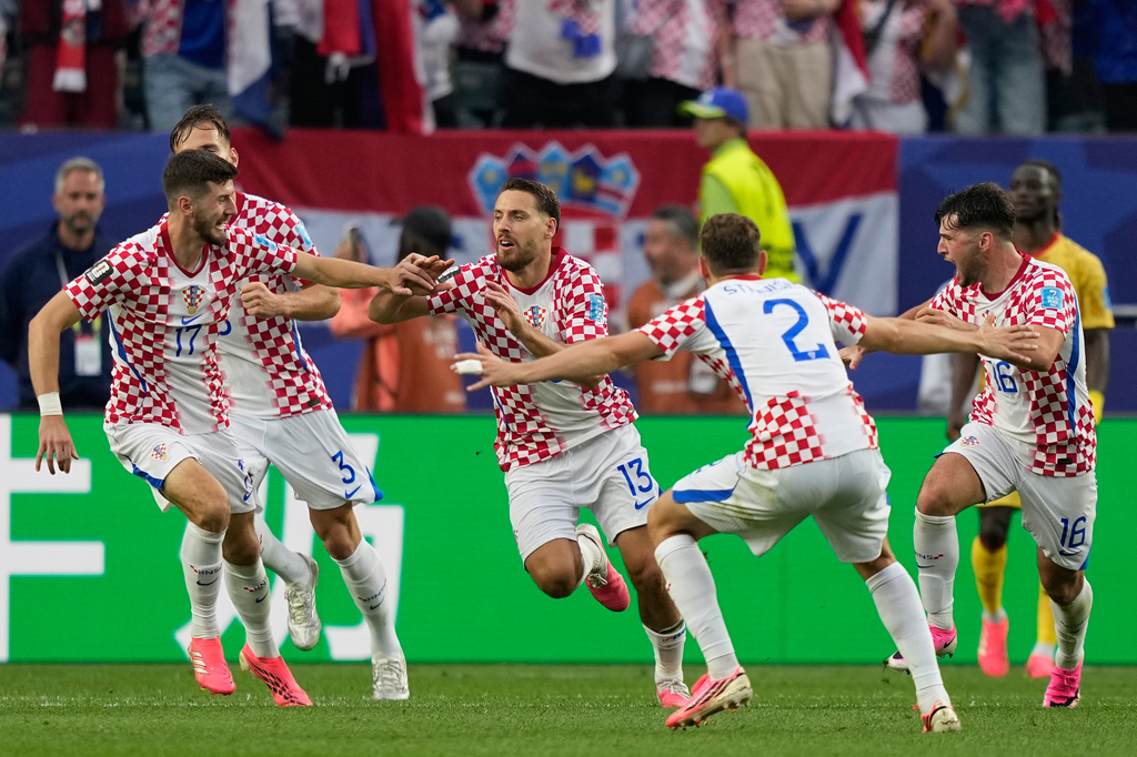 Croatia's Nikola Vlasic (13) celebrates with teammates after scoring his side's second goal during the World Cup Group L soccer match between Croatia and Ghana in Philadelphia, Saturday, June 27, 2026. (AP Photo/Matt Slocum)