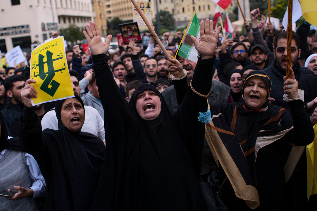 Hezbollah supporters shout slogans during a protest against the Lebanese Prime Minister Nawaf Salam, in front the government palace in Beirut, Lebanon, Friday, April 10, 2026. (AP Photo/Emilio Morenatti)