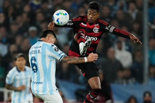 Bruno Henrique of Brazil's Flamengo, right, and Marcos Rojo of Argentina's Racing Club fight for the ball during a Copa Libertadores semifinal second leg soccer match in Buenos Aires, Argentina, Wednesday, Oct. 29, 2025. (AP Photo/Gustavo Garello) Bruno Henrique of Brazil's Flamengo, right, and Marcos Rojo of Argentina's Racing Club fight for the ball during a Copa Libertadores semifinal second leg soccer match in Buenos Aires, Argentina, Wednesday, Oct. 29, 2025. (AP Photo/Gustavo Garello)