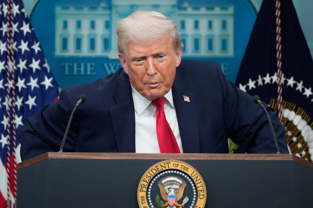 President Donald Trump listens to a question from a reporter during a press briefing at the White House in Washington, Tuesday, Jan. 20, 2026. (AP Photo/Mark Schiefelbein)