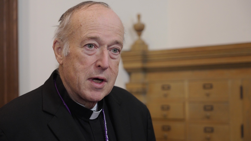 Cardinal Robert speaks to reporters after a mass in solidarity with migrants at the Chapel of St. Thomas Aquinas on Friday, Feb. 27, 2026 in St. Paul, Minn. (AP Photo/Mark Vancleave)