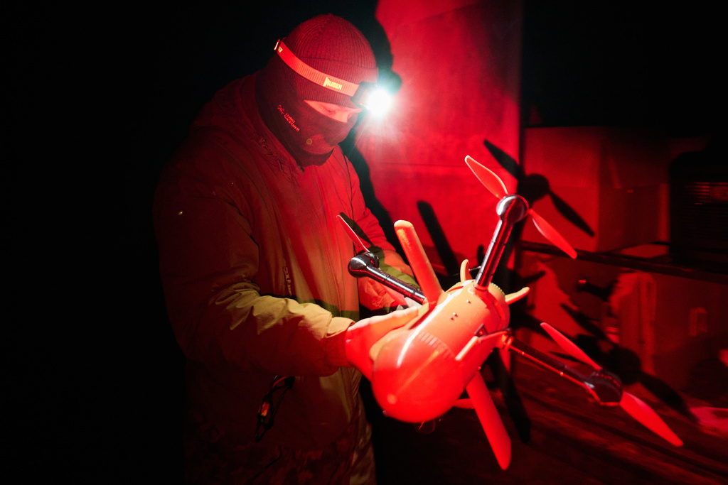 A Ukrainian soldier prepares an interceptor drone during Russia's aerial attack in an undisclosed location in Ukraine, on Dec. 13, 2025. (AP Photo/Efrem Lukatsky)