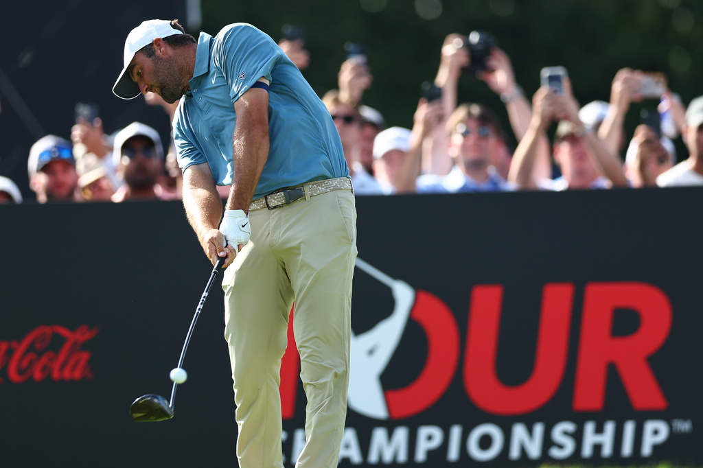 Scottie Scheffler hits from 18th tee during the final round of the PGA Tour Championship golf tournament Sunday, Aug. 30, 2026, in Atlanta. (AP Photo/Colin Hubbard)