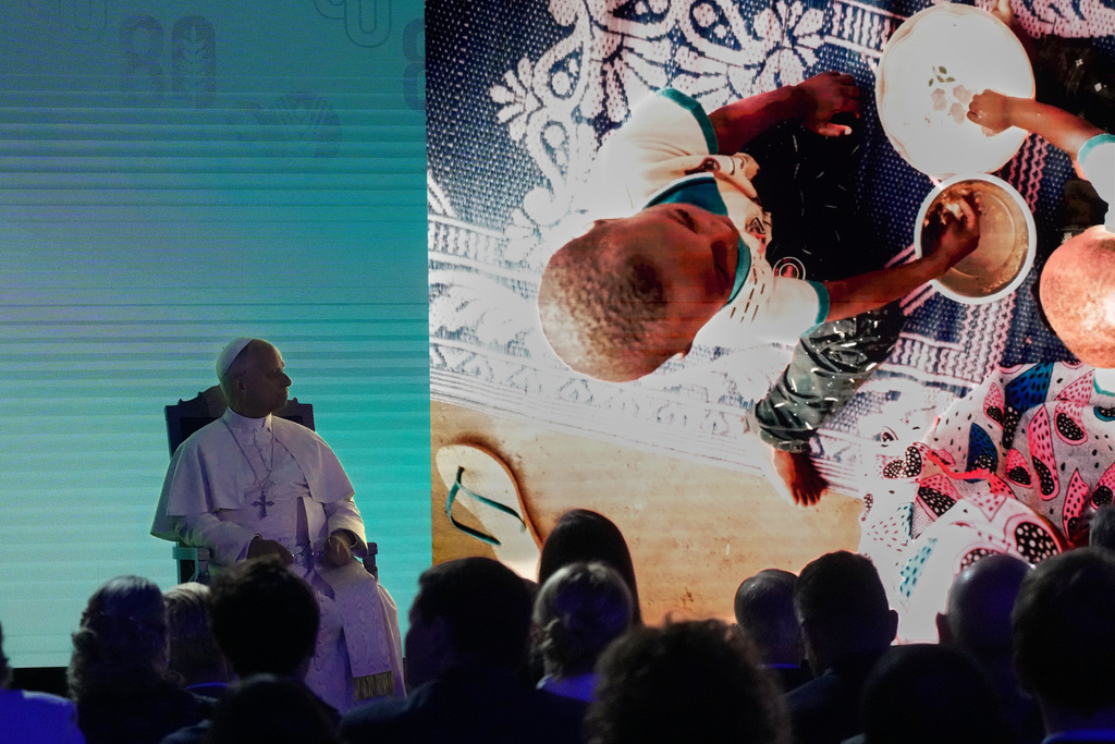Pope Leo XIV, left, attends the ceremony marking the 80th anniversary of World Food Day at the FAO headquarters in Rome, Thursday, Oct. 16, 2025. (AP Photo/Gregorio Borgia)