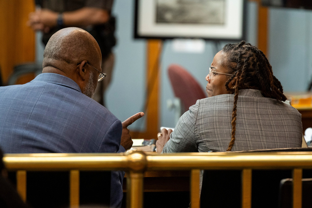 Ebony Parker, right, speaks with her attorney, Curtis M. Rogers, as her trial on felony child neglect charges was dismissed at Newport News Circuit Court in Newport News, Va., Thursday, May 21, 2026. (Peter Casey/The Virginian-Pilot via AP, Pool)