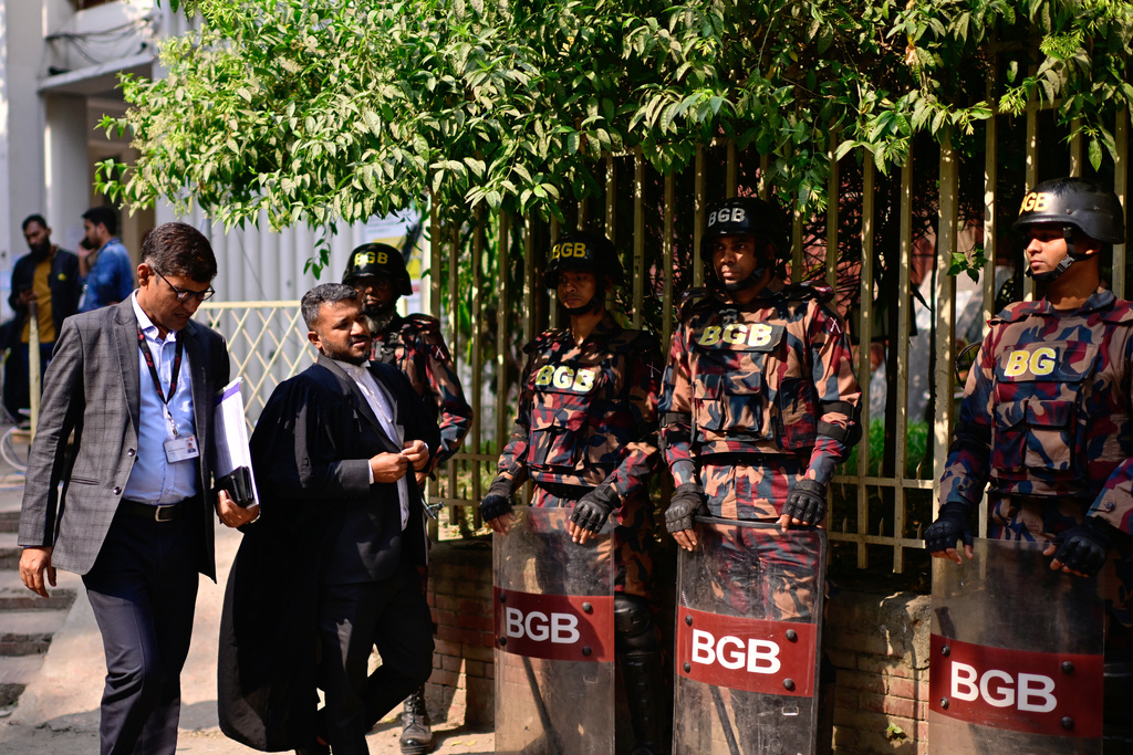 Soldiers from Border Guard Bangladesh stand guard at the Dhaka Special Judge's Court in Dhaka, Bangladesh, Monday, Dec. 1, 2025. (AP Photo/Mahmud Hossain Opu)