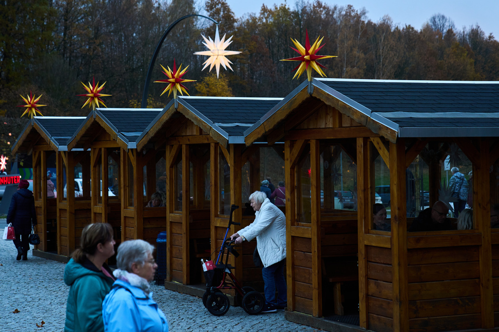 People visit Herrnhuter Sterne GmbH manufacturing, a Christmas stars manufacturing company in Herrnhut, Germany, Nov. 10, 2025. (AP Photo/Ebrahim Noroozi)