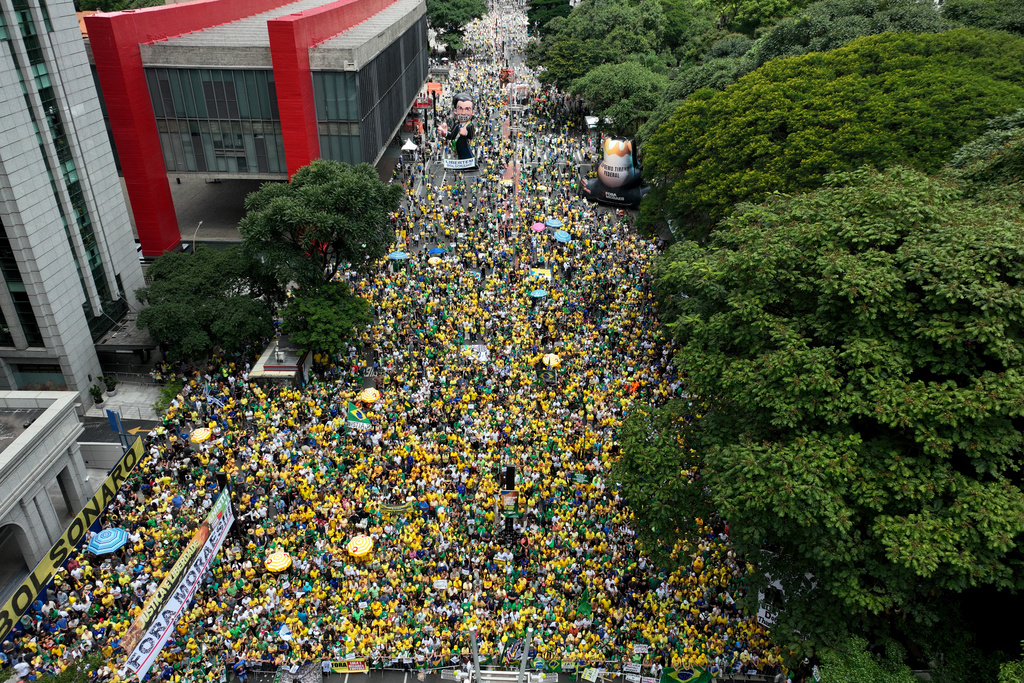 Supporters of former President Jair Bolsonaro take part in a protest against President Luiz Inacio Lula da Silva in Sao Paulo, Sunday, March 1, 2026. (AP Photo/Andre Penner)