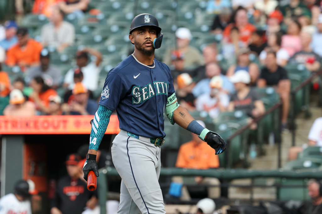 Seattle Mariners' Julio Rodríguez walks off the field after striking out against Baltimore Orioles pitcher Brandon Young during the third inning of a baseball game, Wednesday, June 10, 2026, in Baltimore. (AP Photo/Terrance Williams)