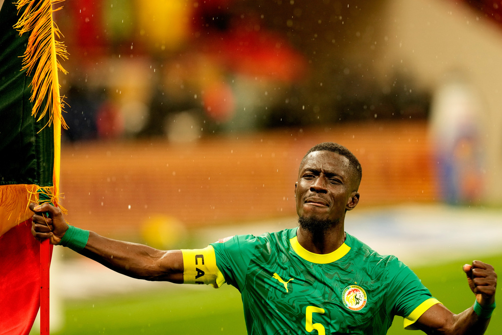 Senegal's Idrissa Gueye celebrates after winning the Africa Cup of Nations final soccer match between Senegal and Morocco, in Rabat, Morocco, Sunday, Jan. 18, 2026. (AP Photo/Themba Hadebe)