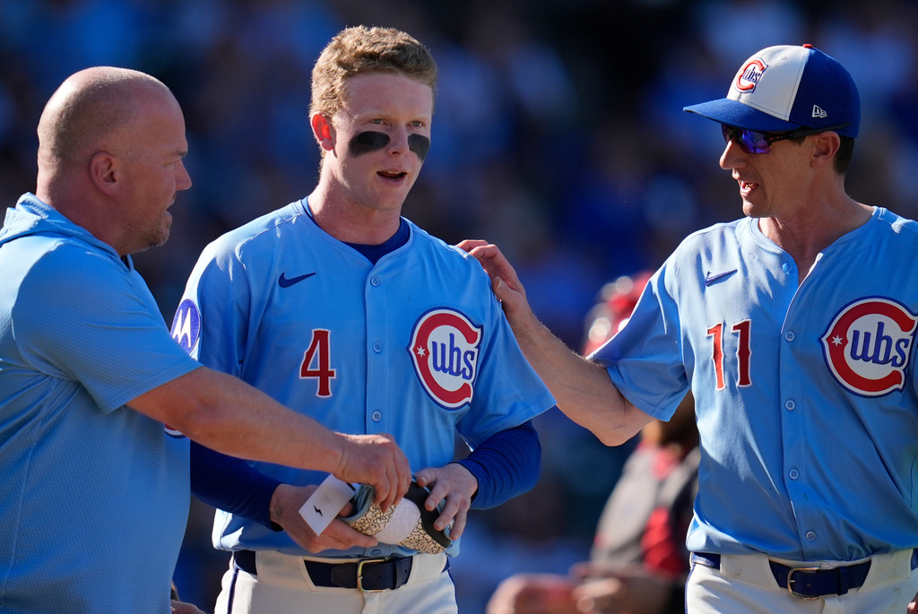 Chicago Cubs' Pete Crow-Armstrong (4) walks to first after getting hit by a pitch from St. Louis Cardinals pitcher Chris Roycroft (58) during the seventh inning of a baseball game Friday, Sept. 26, 2025, in Chicago. (AP Photo/Erin Hooley)
