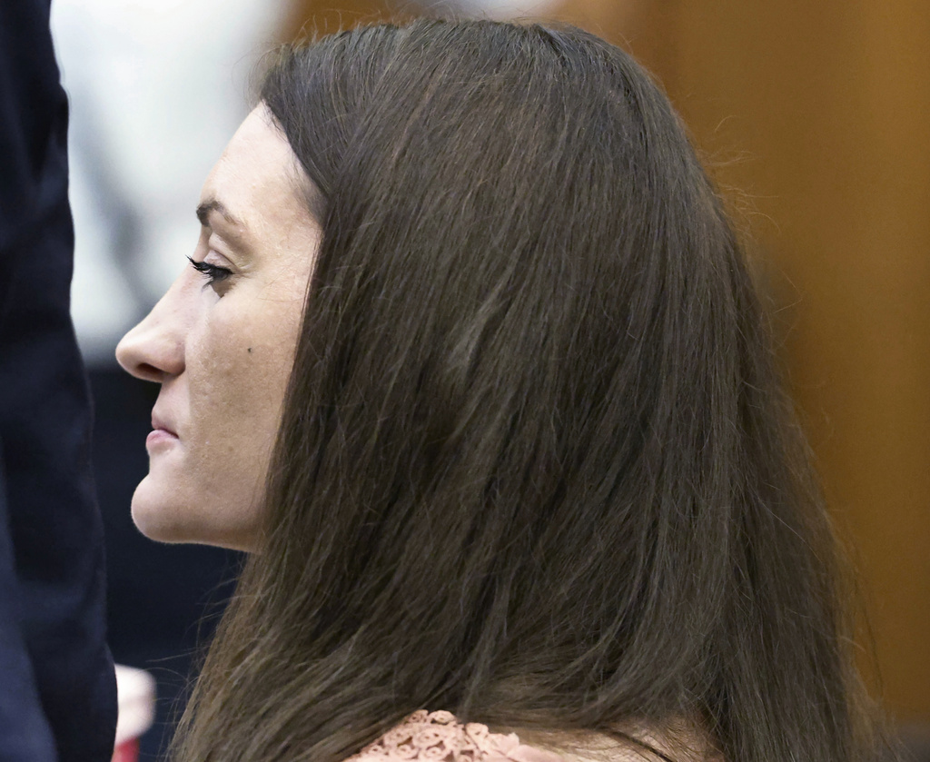 Lindsay Clancy grins after her attorney Kevin Reddington concluded his cross examination of rebuttal witness Dr. Avram Mack during her murder trial at Plymouth Superior Court, Monday, Aug. 24, 2026 in Plymouth, Mass. (Greg Derr/The Patriot Ledger via AP, Pool)