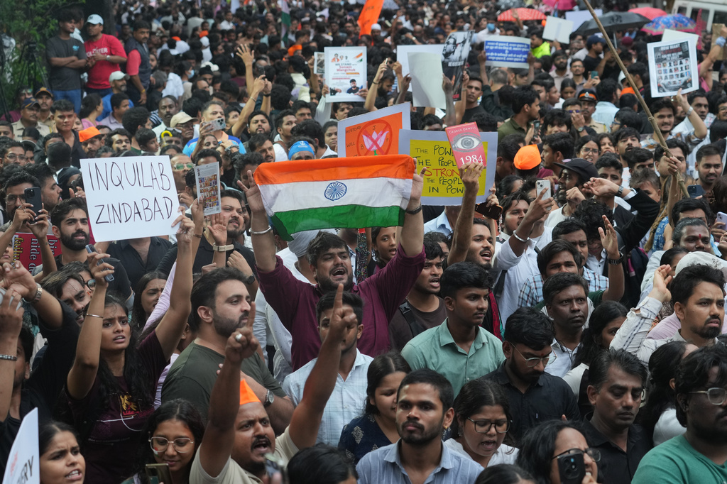 Supporters of the Cockroach Janta Party shout slogans during a protest demanding the resignation of Education Minister Dharmendra Pradhan over alleged examination irregularities and repeated paper leaks in Mumbai, India, Sunday, July 19, 2026. (AP Photo/Rafiq Maqbool)