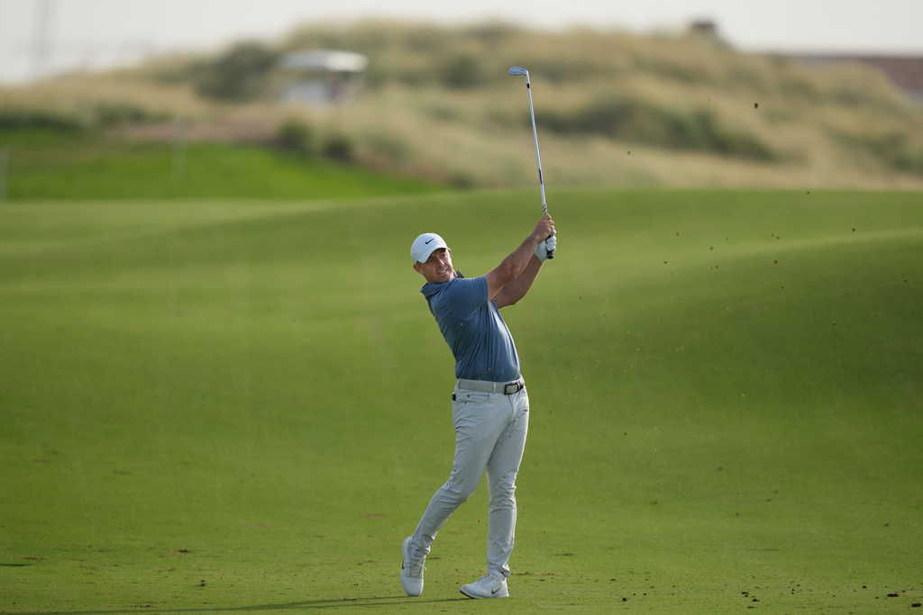 Rory McIlroy of Northern Ireland plays his second shot on the 17th hole during the second round of Abu Dhabi Golf Championship in Abu Dhabi, United Arab Emirates, Friday, Nov. 7, 2025. (AP Photo/Altaf Qadri)
