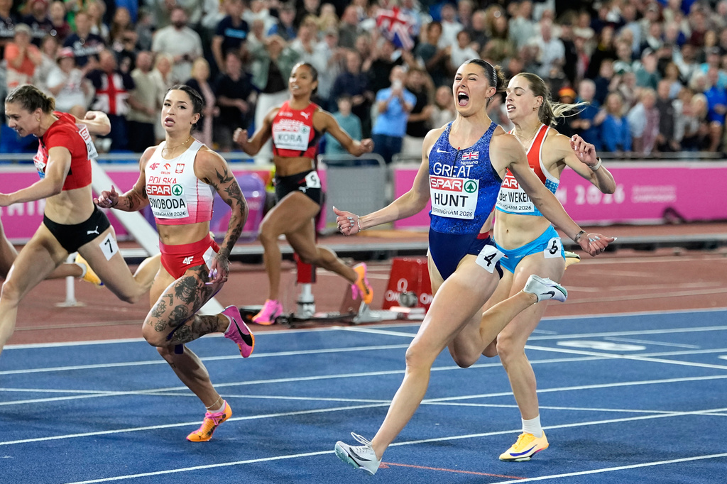 Britain's Amy Hunt reacts after crossing the finish line ahead of Poland's Ewa Swoboda to win the women's 100 meters final at the European Athletics Championships in Birmingham, England, Monday, Aug. 10, 2026. (AP Photo/Matthias Schrader)