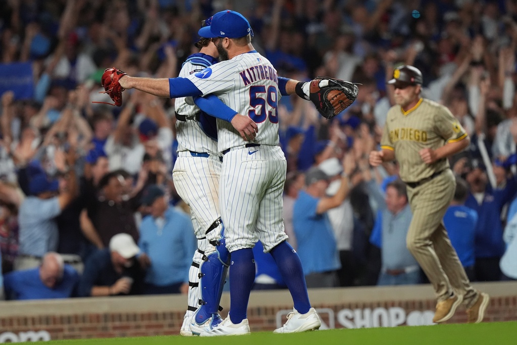 Chicago Cubs' Andrew Kittredge and Carson Kelly celebrate after Game 3 of a National League wild card baseball game against the San Diego Padres Thursday, Oct. 2, 2025, in Chicago. (AP Photo/Nam Huh)
