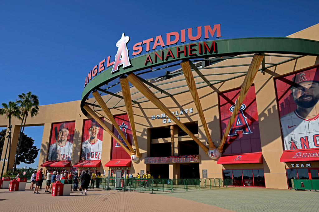 FILE - People line up outside Angel Stadium prior to a baseball game between the Los Angeles Angels and the Cleveland Guardians, Aug. 24, 2026, in Anaheim, Calif. (AP Photo/Jayne Kamin-Oncea, File)