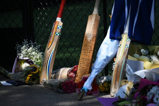Cricket bats, flowers and notes make an impromptu tribute Thursday, October 30, 2025, for a teenaged cricket player who died in a training accident in Melbourne, Australia. (James Ross/AAP Image via AP) Cricket bats, flowers and notes make an impromptu tribute Thursday, October 30, 2025, for a teenaged cricket player who died in a training accident in Melbourne, Australia. (James Ross/AAP Image via AP)