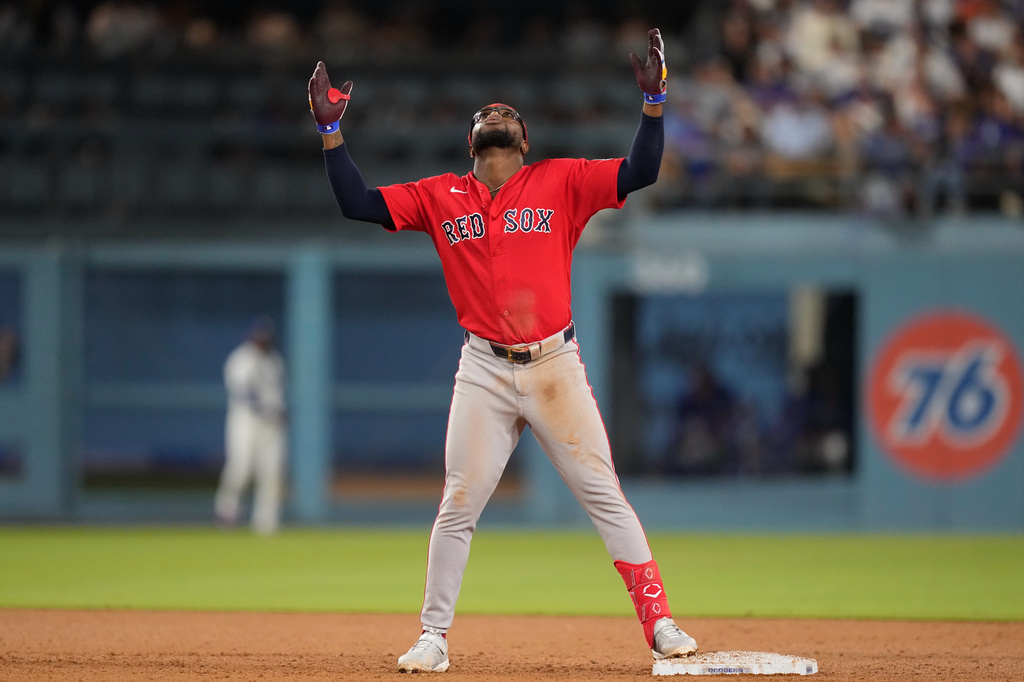 Boston Red Sox's Andruw Monasterio gestures after hitting a two RBI double during the seventh inning of a baseball game against the Los Angeles Dodgers, Friday, July 31, 2026, in Los Angeles. (AP Photo/Mark J. Terrill)