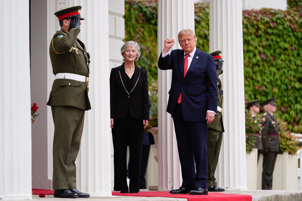 Ireland's President Catherine Connolly, center left, greets U.S. President Donald Trump, center right, during a meeting at Áras an Uachtaráin in Dublin, Saturday, Sept. 12, 2026. (AP Photo/Julia Demaree Nikhinson)