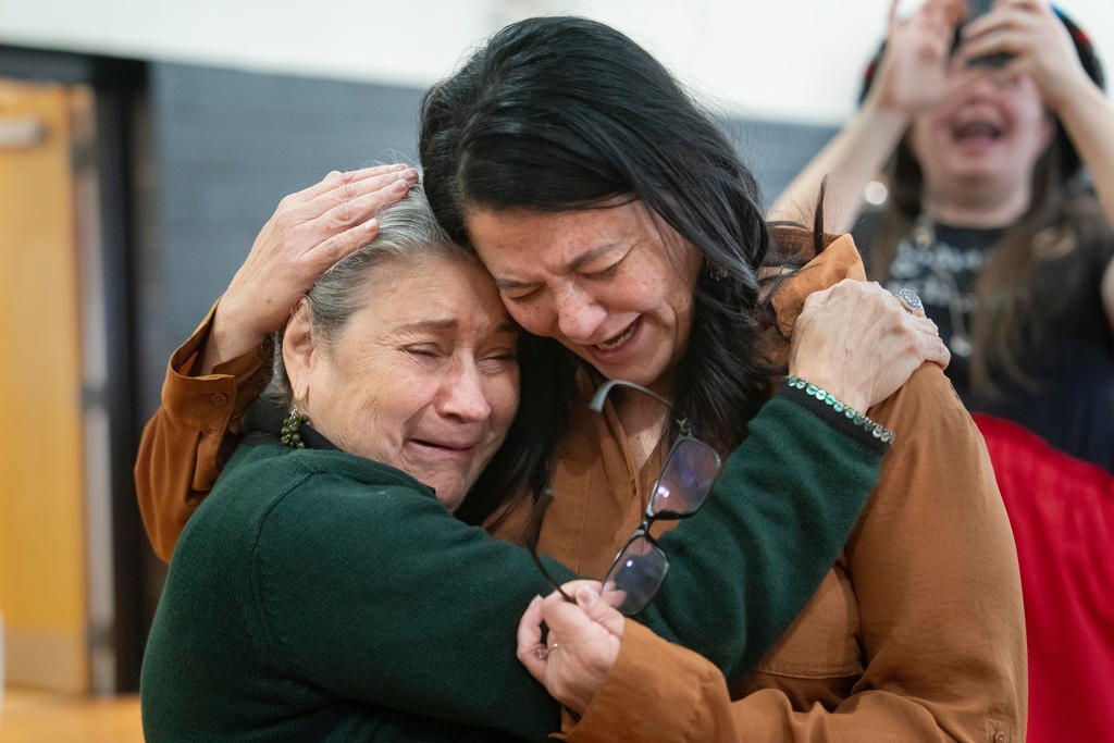 People celebrate after passage of the National Defense Authorization Act by the U.S. Senate, during a watch party hosted by the Lumbee Tribe of North Carolina, Wednesday, Dec. 17, 2025, in Pembroke, N.C. (AP Photo/Allison Joyce)