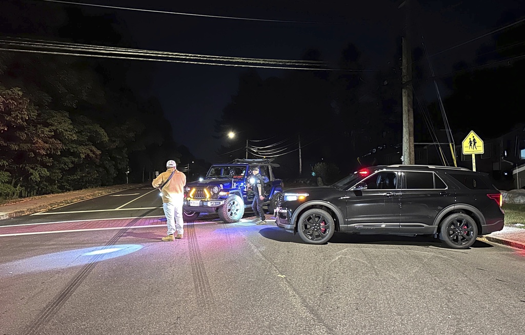 Police block a road to a country club where a shooting happened at Sky Meadow Country Club in Nashua, New Hampshire, Saturday, Sept. 20, 2025. (AP Photo/Michael Casey)