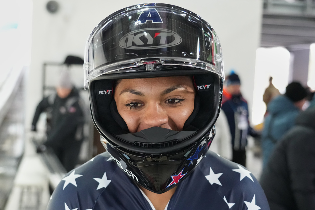 Kaysha Love of the United States reacts after finishing second in a women's monobob World Cup race and Olympic test event in Cortina d'Ampezzo, Italy, Saturday, Nov. 22, 2025. (AP Photo/Andrew Medichini)