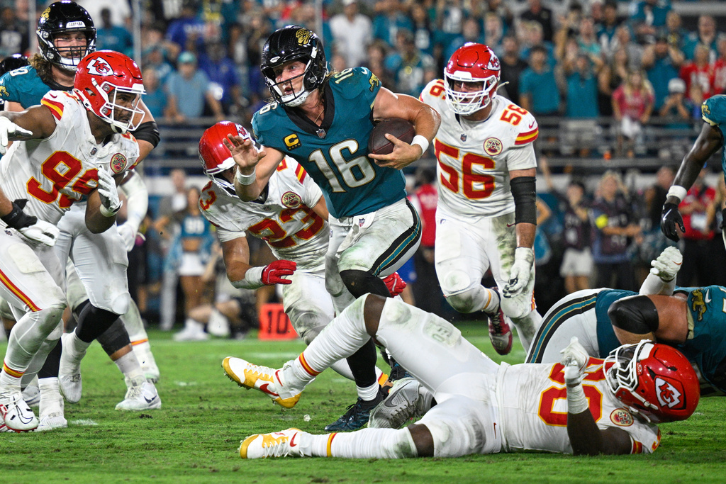 Jacksonville Jaguars quarterback Trevor Lawrence (16) runs for a touchdown during the second half of an NFL football game against the Kansas City Chiefs, Monday, Oct. 6, 2025, in Jacksonville, Fla. (AP Photo/Phelan M. Ebenhack)