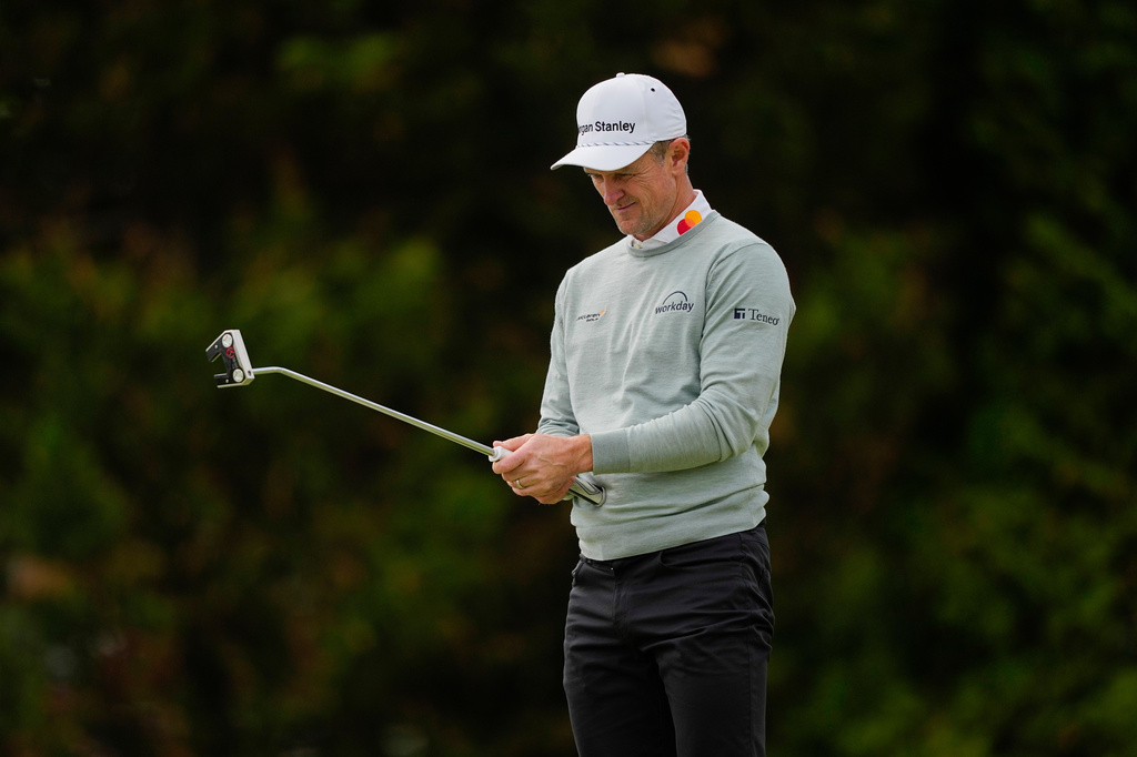 Justin Rose, of England, lines up his putt on the 12th green during the second round of the PGA Championship golf tournament at Aronimink Golf Club, Friday, May 15, 2026, in Newtown Square, PA. (AP Photo/Carolyn Kaster)