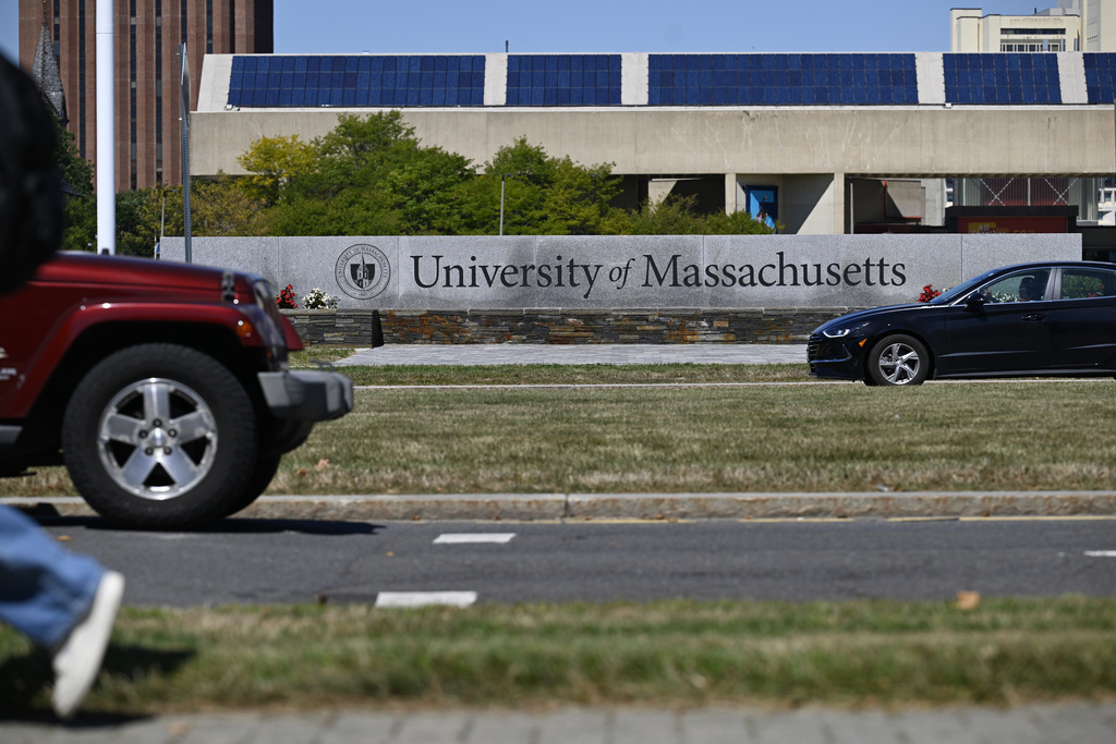 In this Sept. 3, 2025 photo, Cars pass by the University of Massachusetts, in Amherst, Mass. (AP Photo/Jessica Hill)