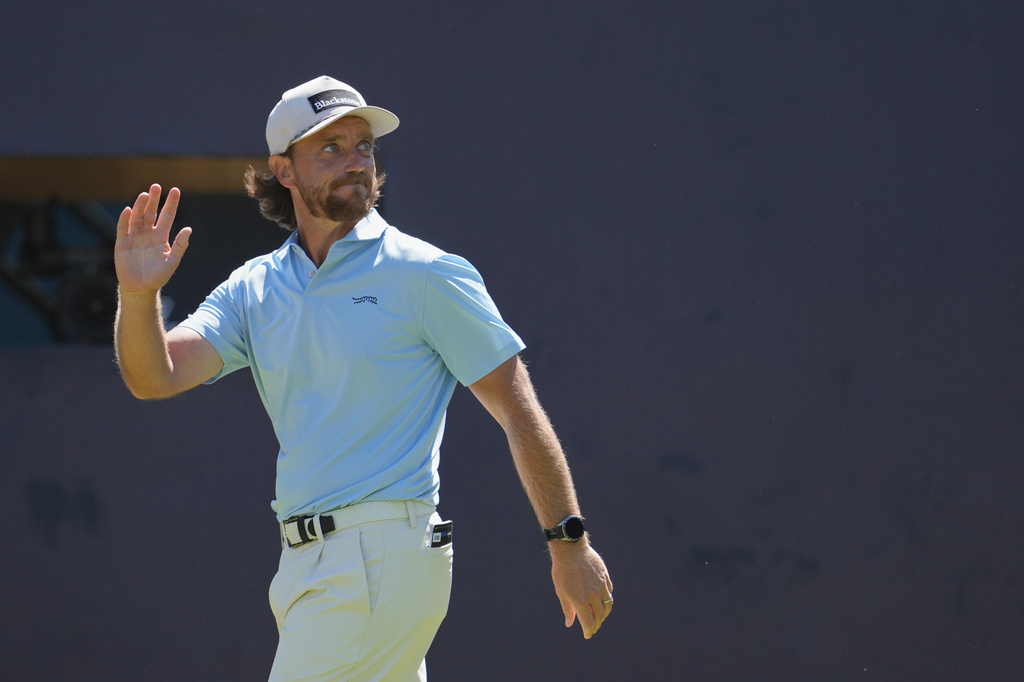 Tommy Fleetwood of England waves to the crowd as he arrives on the 1st tee during the final day of the British Open Golf championships at Royal Birkdale golf club, in Southport, England, Sunday, July 19, 2026. (AP Photo/Jon Super)