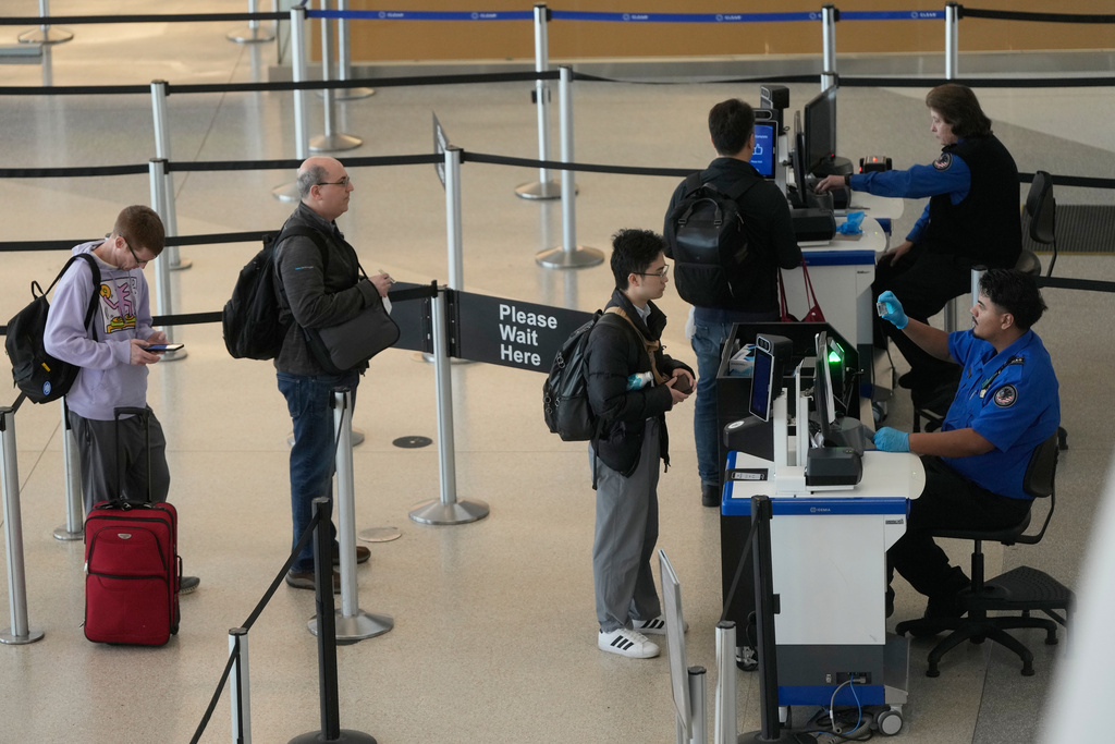 Covenant Aviation Security Private Security Services agents check in passengers at a security gate at San Francisco International Airport in San Francisco, Friday, Feb. 27, 2026. (AP Photo/Jeff Chiu)