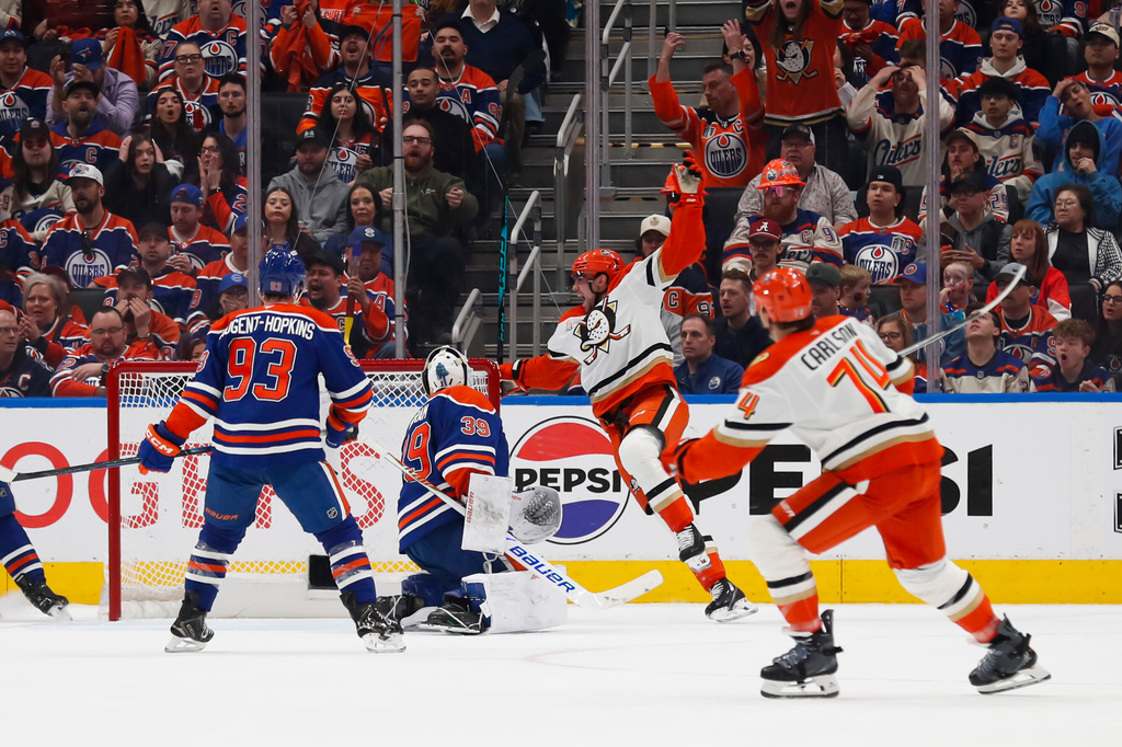 Anaheim Ducks' Ryan Poehling (25) celebrates a goal against Edmonton Oilers goaltender Connor Ingram (39) during second period NHL playoff action in Edmonton on Wednesday, April 22, 2026. (Codie McLachlan/The Canadian Press via AP)