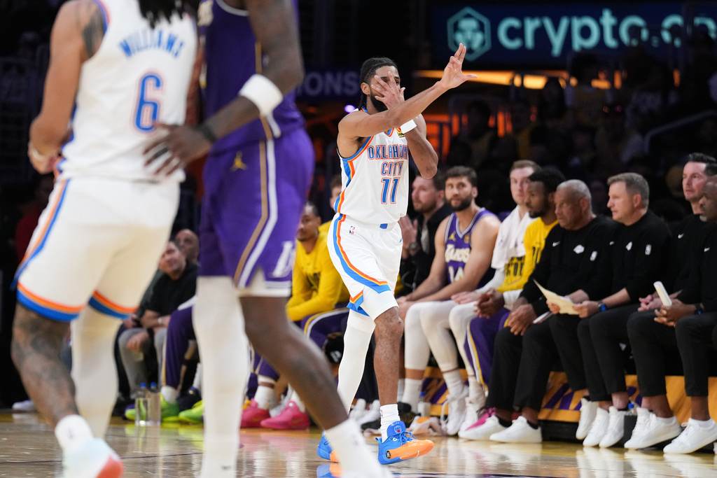 Oklahoma City Thunder guard Isaiah Joe celebrates his three-point basket during the first half of an NBA basketball game against the Los Angeles Lakers Monday, Feb. 9, 2026, in Los Angeles. (AP Photo/Jae C. Hong)