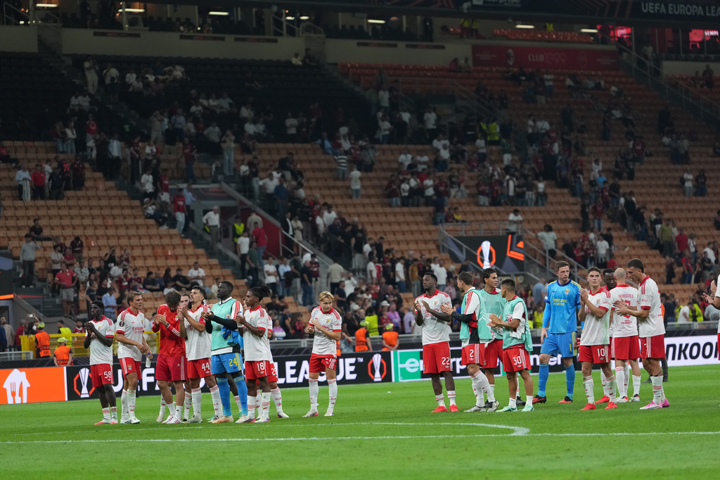 Benfica players celebrate at the end of the Europa League opening phase soccer match between AC Milan and Benfica in Milan, Italy, Wednesday, Sept. 16, 2026. (AP Photo/Antonio Calanni)