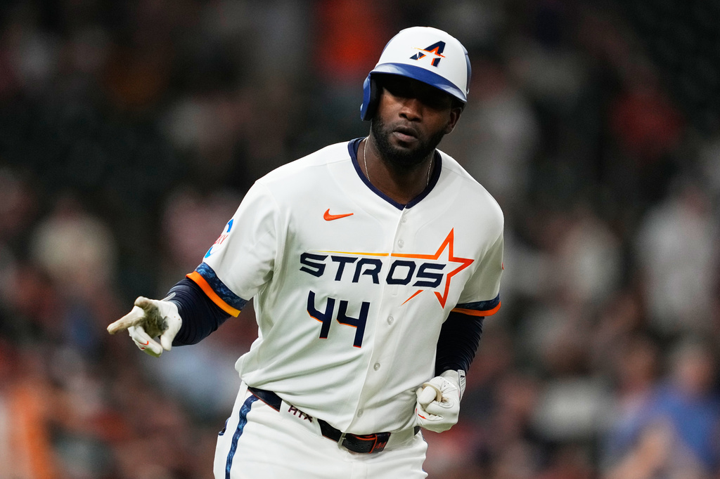 Houston Astros designated hitter Yordan Alvarez celebrates as he runs the bases after hitting a home run during the third inning of a baseball game against the Boston Red Sox in Houston, Monday, March 30, 2026. (AP Photo/Ashley Landis)
