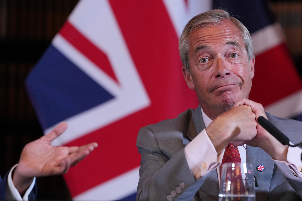Nigel Farage, Leader of Britain's Reform UK party, attends a press conference in London, Monday, Aug. 10, 2026. (AP Photo/Kin Cheung)