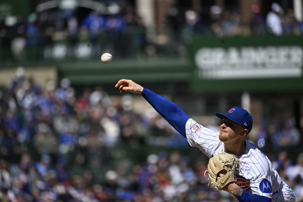 Chicago Cubs pitcher Cade Horton (22) delivers during the first inning of a baseball game against the Washington Nationals, Saturday, March 28, 2026, in Chicago. (AP Photo/Matt Marton)