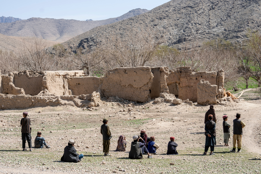 FILE - Children stand in front of a home destroyed during a Sept. 5, 2019, night raid by U.S. forces in a village in a remote region of Afghanistan, on Friday, Feb. 24, 2023. (AP Photo/Ebrahim Noroozi, File)
