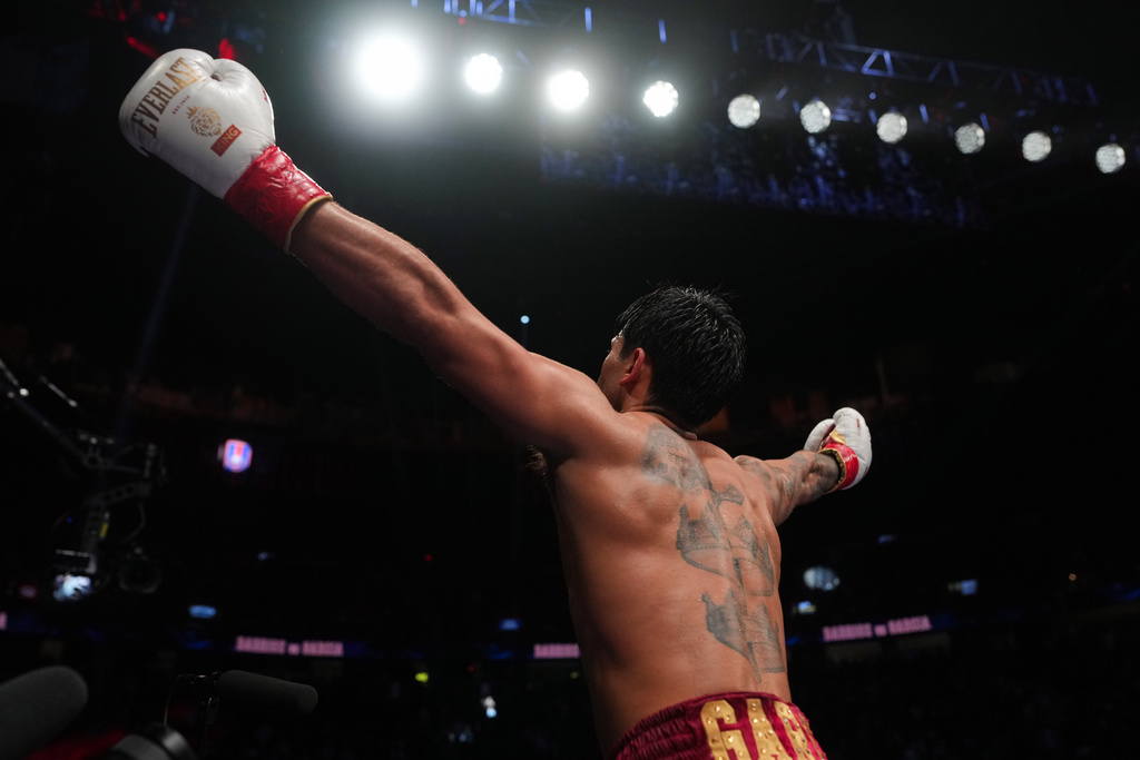 Ryan Garcia celebrates after winning in a WBC welterweight title boxing match against Mario Barrios Saturday, Feb. 21, 2026, in Las Vegas. (AP Photo/Lucas Peltier)